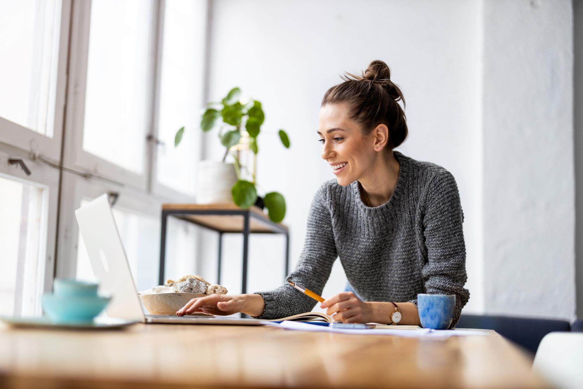 Woman working at computer on her desk